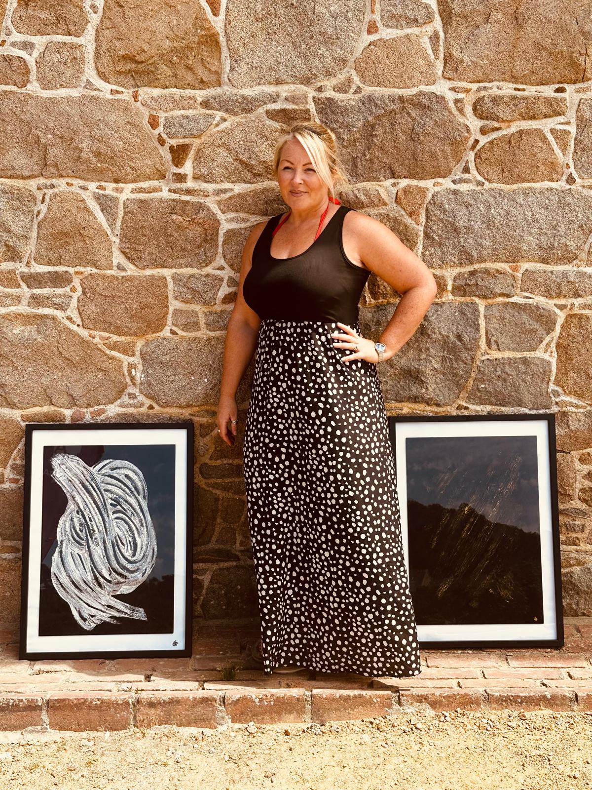 Elizabeth Sarah standing with original artwork